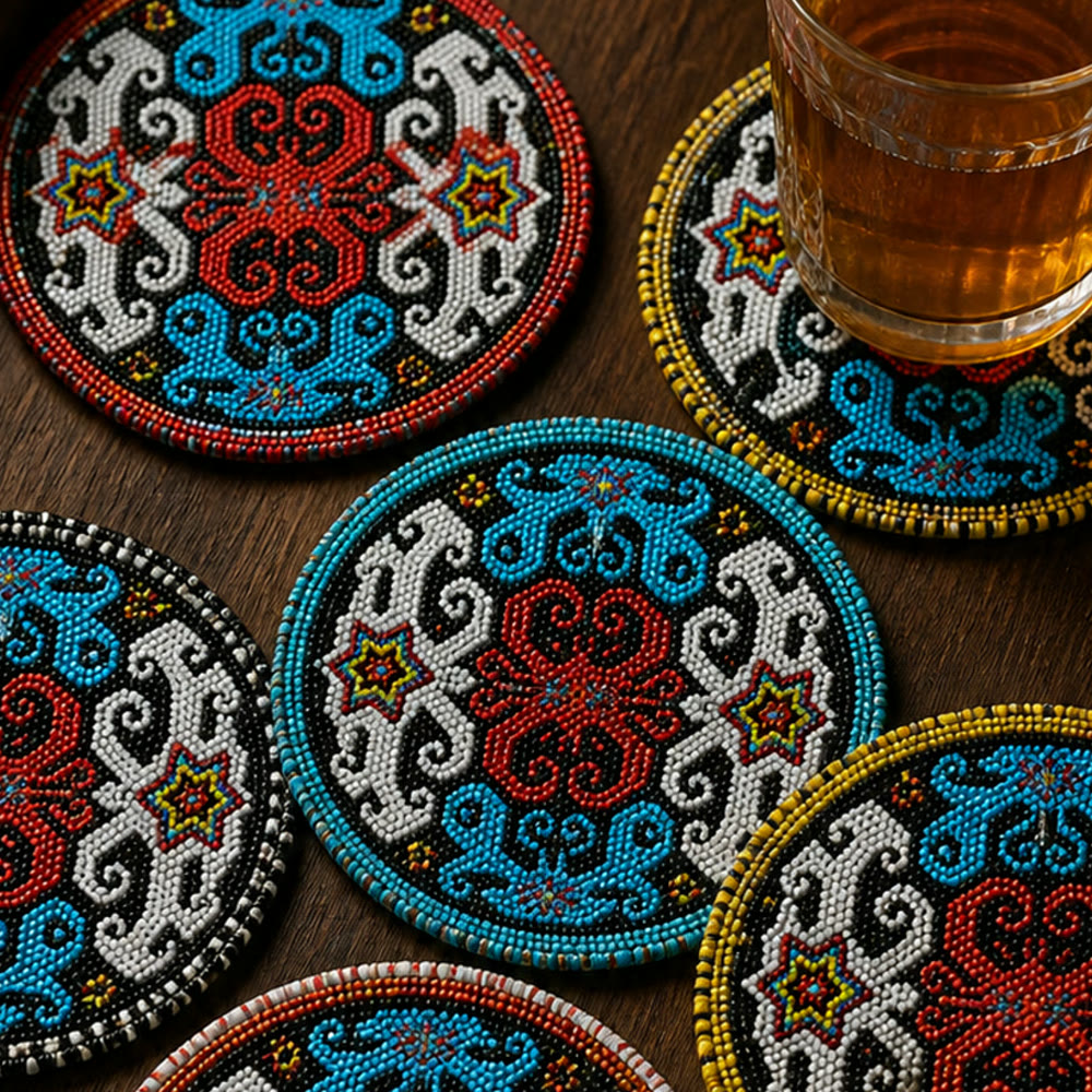 Round beaded borders in red, white, turquoise and yellow around scrolling figures and small stars